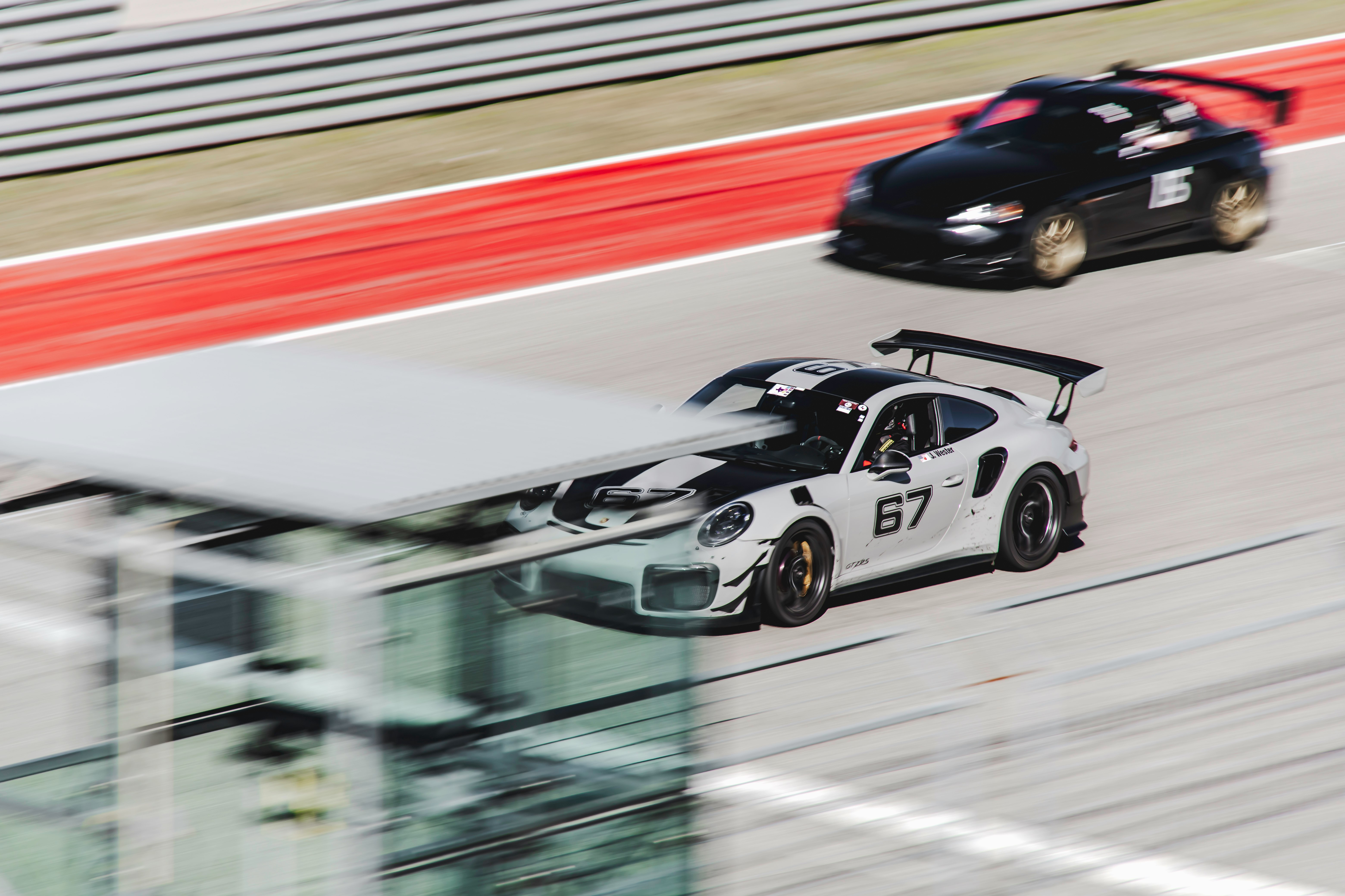 white and black racing car on road